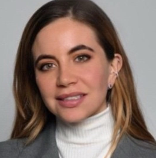 a woman with brown hair and brown eyes