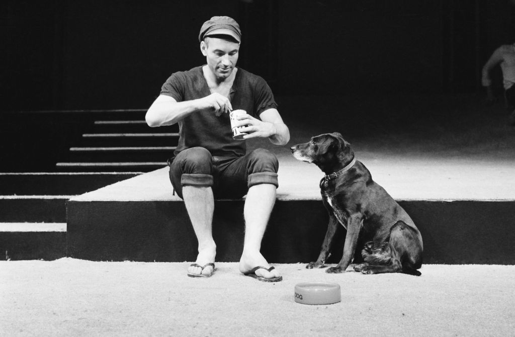 Sir Patrick Stewart feeding his dog, 1970