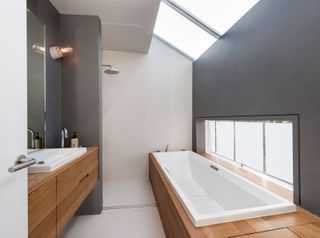 a bathroom with a roof light