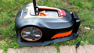 LawnMaster L10 robot mower sat in charging station