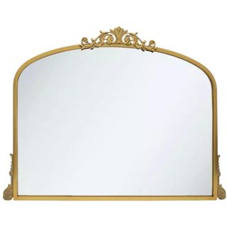 Gold ornate mirror on white background. It has a floral crown