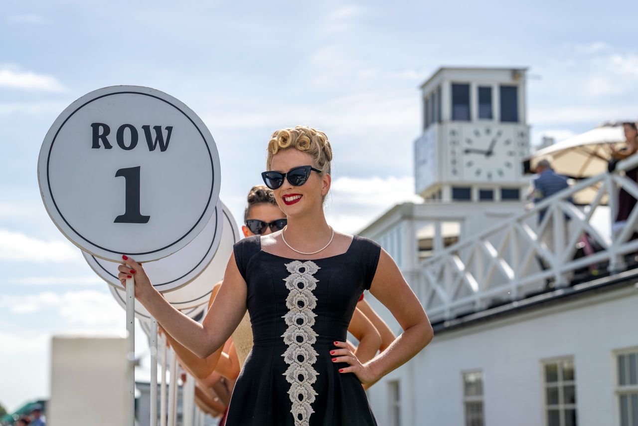 Images from the Revival. Fast cars, people in vintage dress, everyone having a nice time.