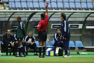 Argentina's Claudio Caniggia is shown the red card on the bench against Sweden by referee Ali Bujsaim at the 2002 World Cup.