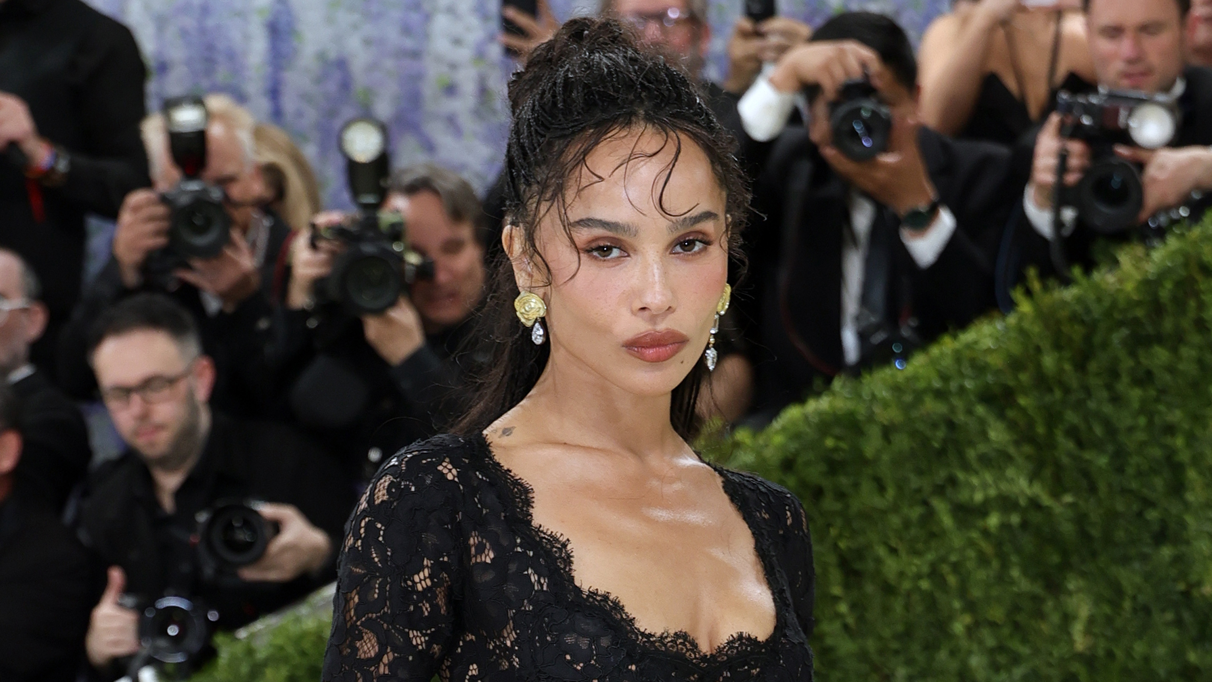 Zoe kravitz wears a black lace dress at the met gala.