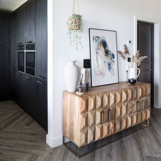 timber textured sideboard in an open plan space