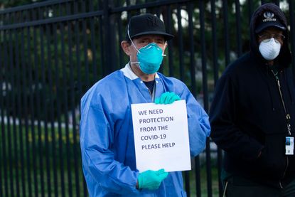 A nurse wearing PPE.