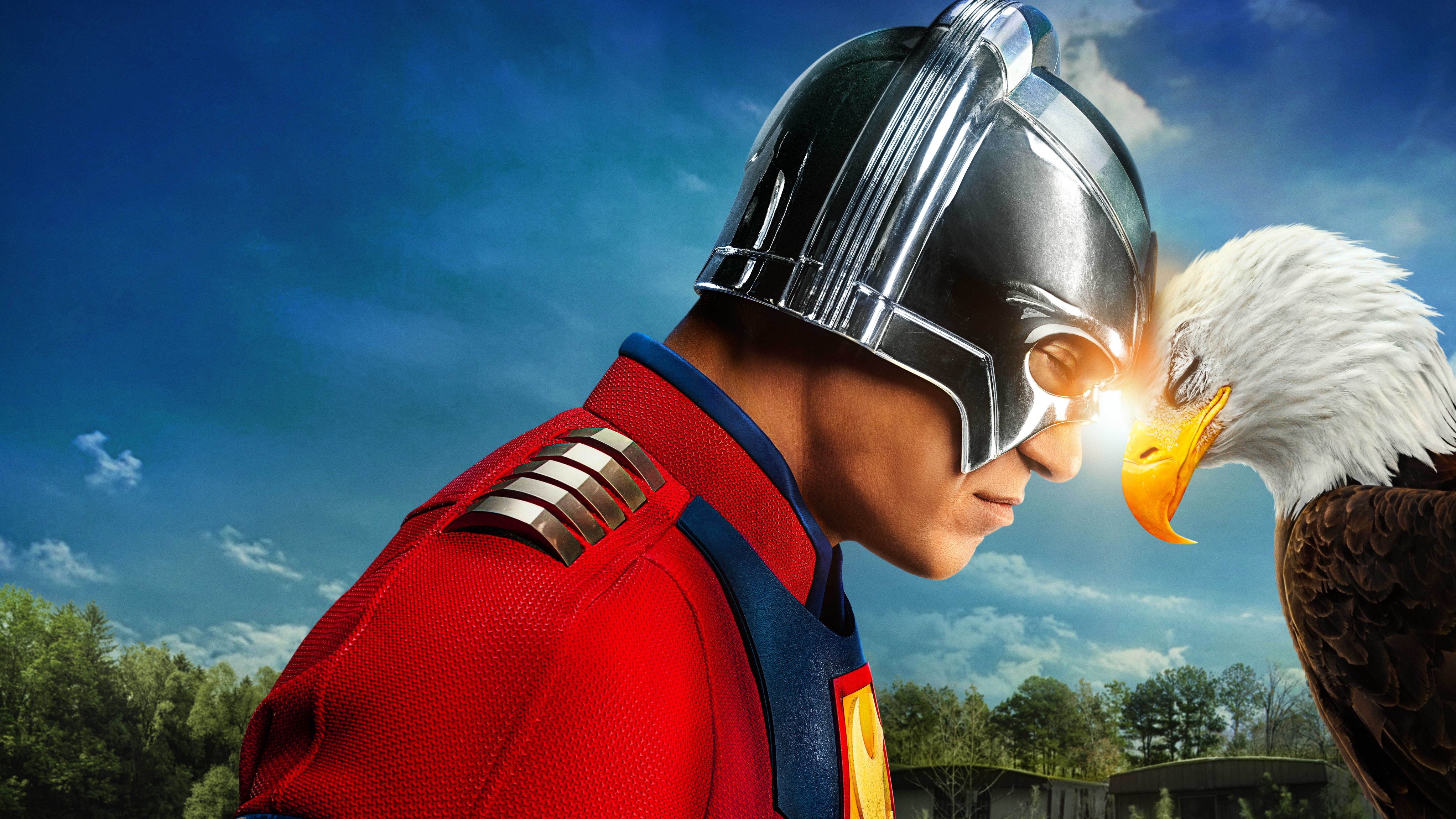Peacemaker and an eagle with their heads together for the key art of Peacemaker 2.