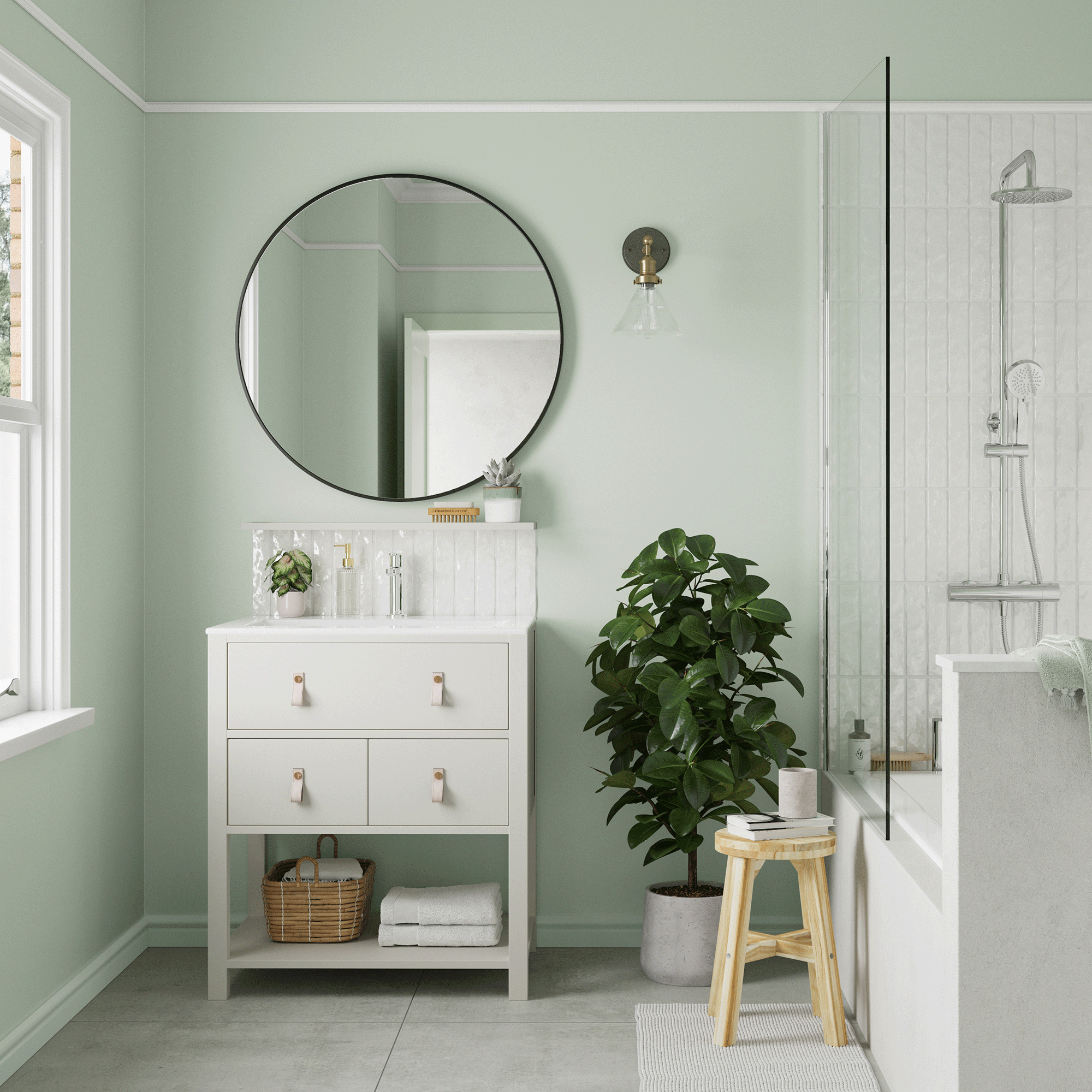 Green bathroom with circular mirror