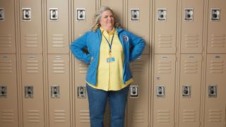 Paula Pell as Helen standing in front of school lockers in A.P. Bio