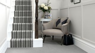 Contemporary halwway with stripey grey stair carpet