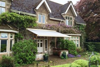 awning ideas: cottage style garden with traditional awning