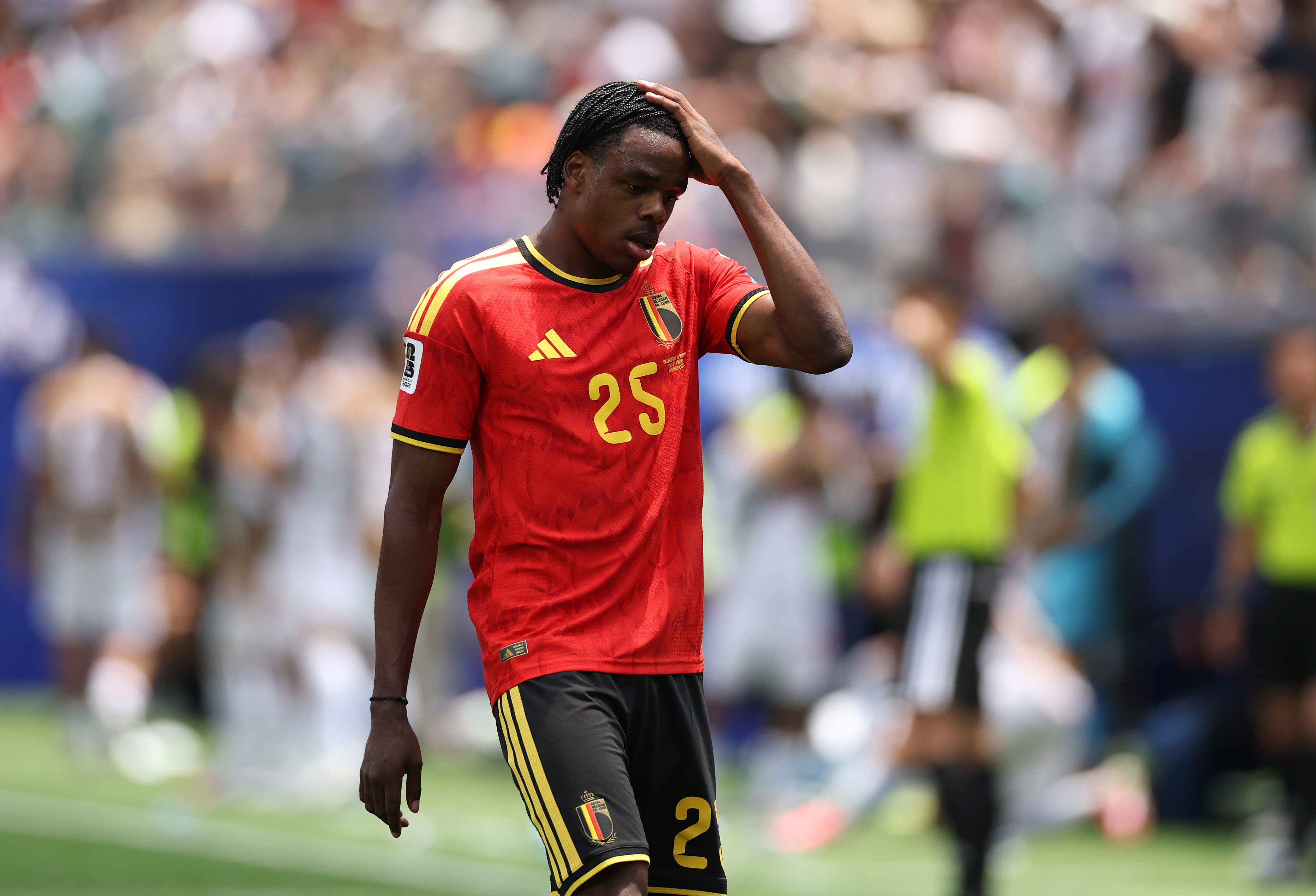 Nathan Ngoy #25 of Belgium walks off the pitch after receiving a red card during the FIFA World Cup 2026 Group G match against Iran at Los Angeles Stadium on June 21, 2026 in Inglewood, California