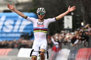 UAE Team Emirates team's Slovenian rider Tadej Pogacar cycles to the finish line to win the 118th edition of the Giro di Lombardia (Tour of Lombardy), a 252km cycling race from Bergamo to Como on October 12, 2024. (Photo by Marco BERTORELLO / AFP)