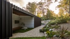 A winding garden space with an outdoor living space