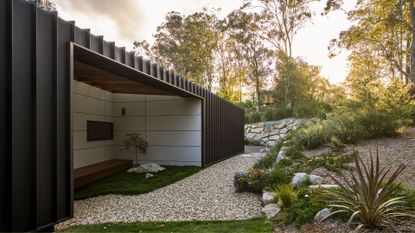 A winding garden space with an outdoor living space