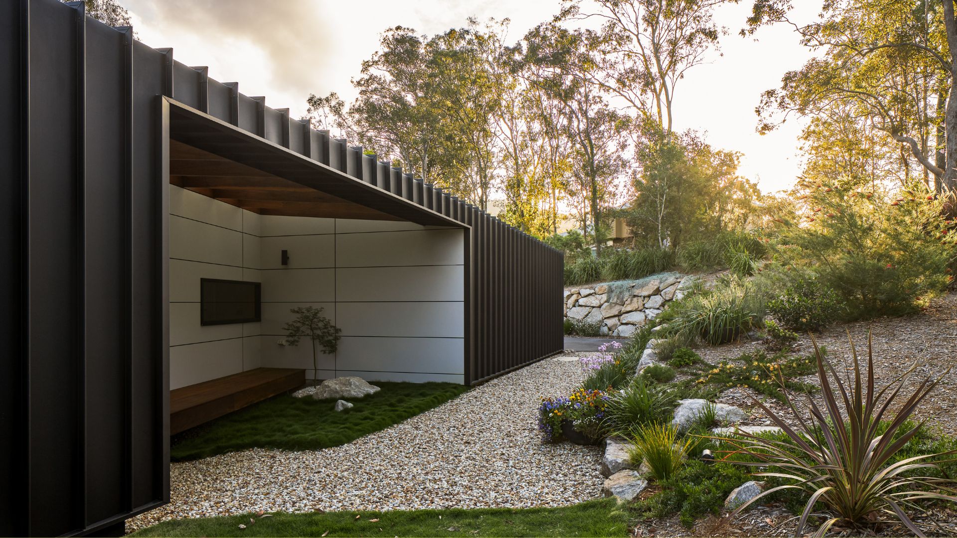 A winding garden space with an outdoor living space