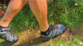 Man running in Xero Mesa Trail WP lightweight running shoes