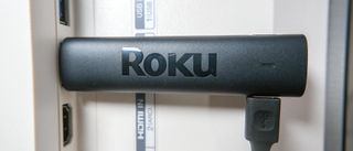 The Roku Streaming Stick 4K plugged into an HDMI port