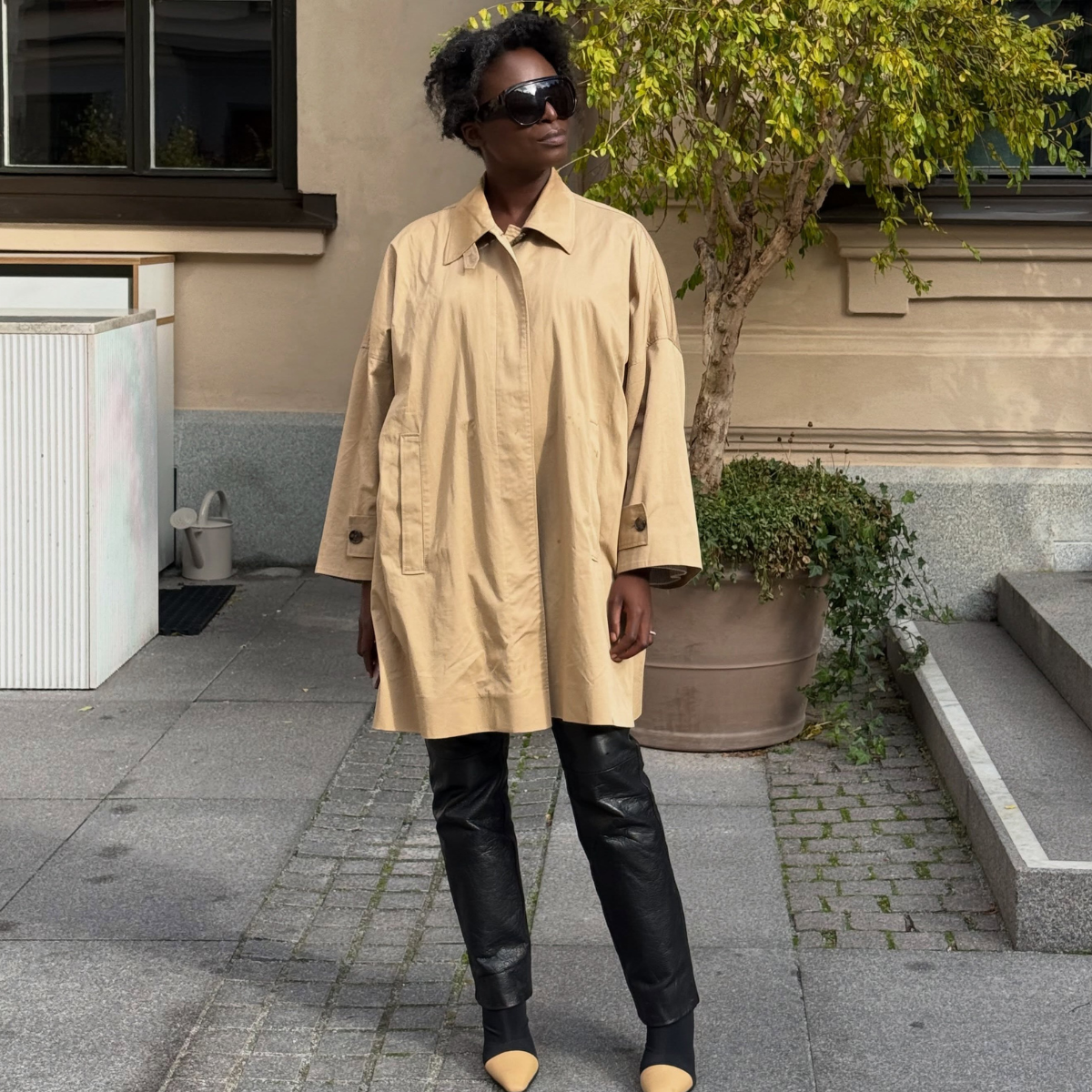 An image of a woman wearing fall leather pants outfit 2026