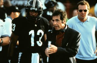 al pacino stands on the football field with a team in any given sunday