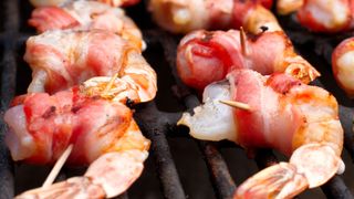Low Carb or Keto Bacon Wrapped Shrimp on a grill