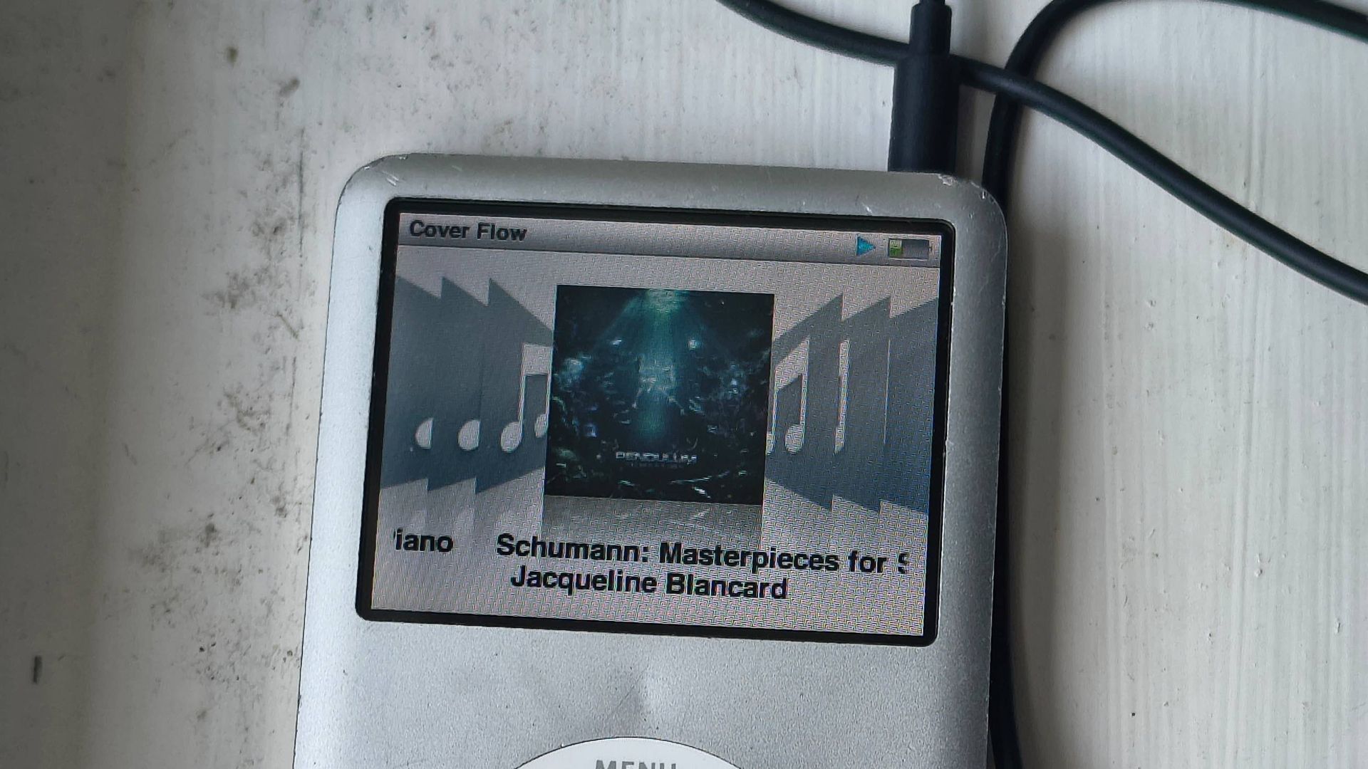 The iPod Classic on a window sill.