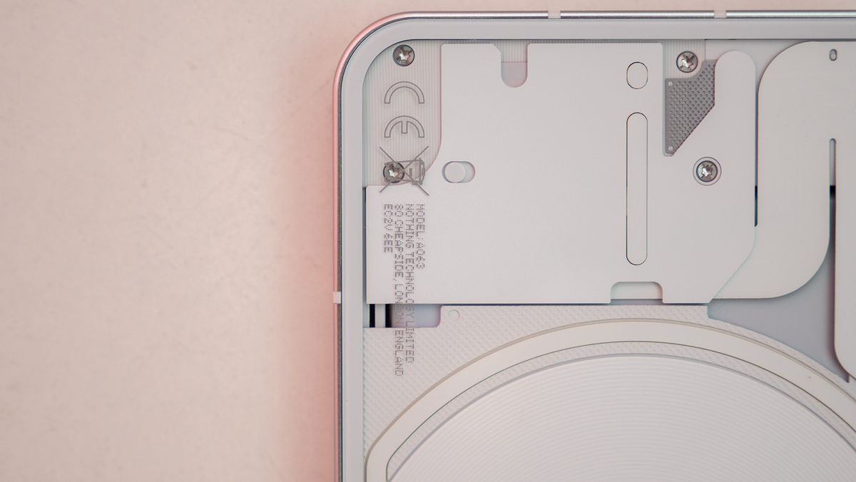 Nothing phone (1) close-up of the electronics behind the phone's transparent back
