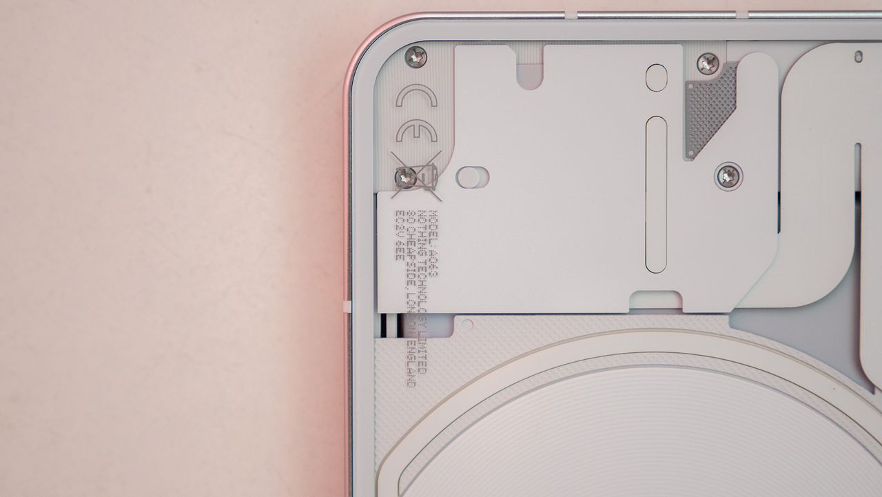 Nothing phone (1) close-up of the electronics behind the phone's transparent back