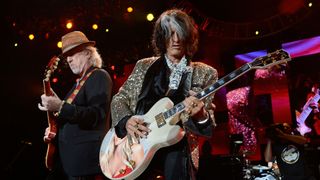 Brad Whitford (left) and Joe Perry perform onstage