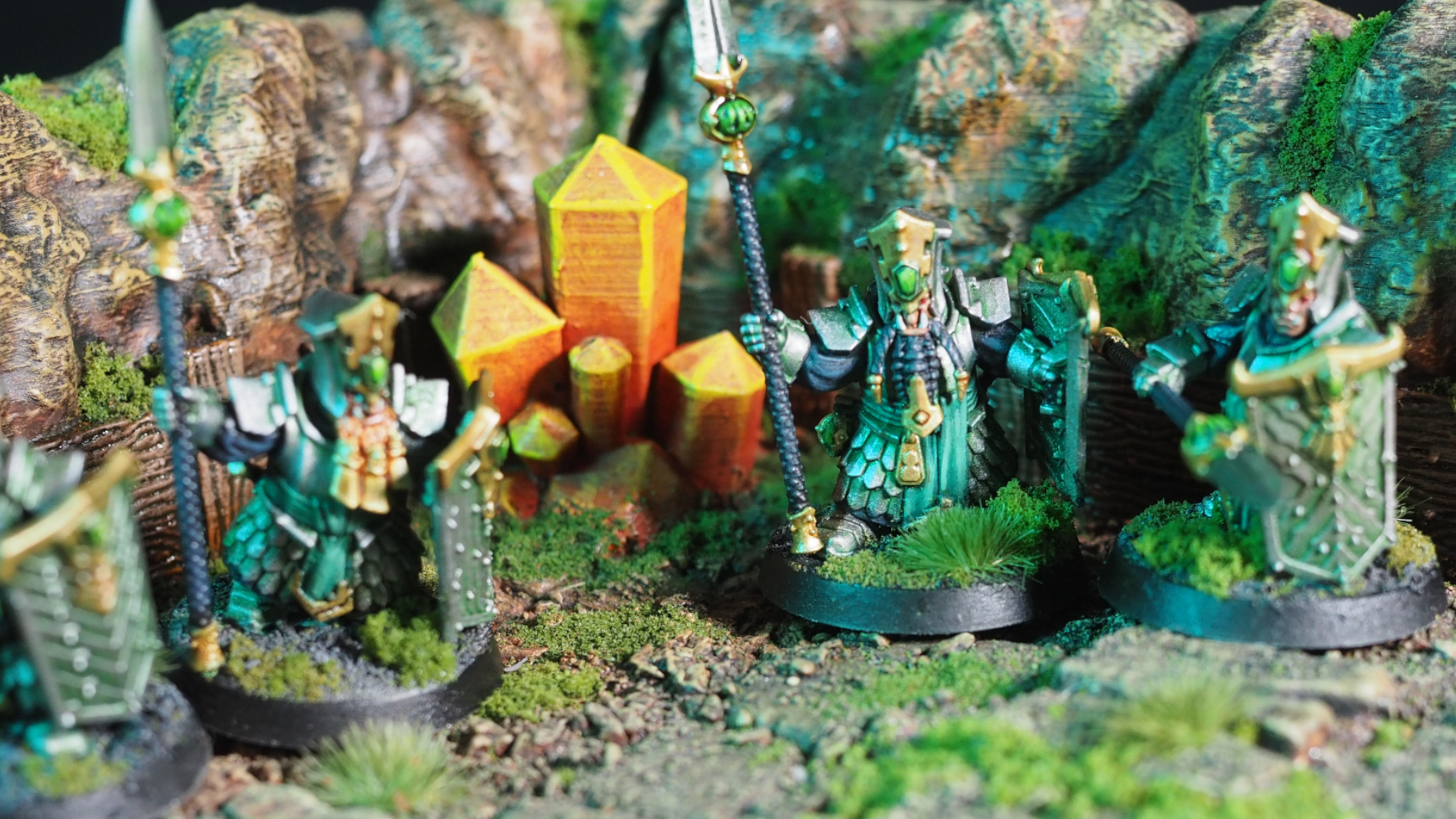 A band of Helsmiths of Hashut with spears in a rocky environment beside orange crystals
