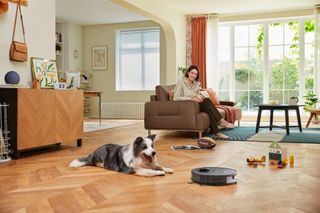 Eureka E20 Plus robot vacuum in action and docked.