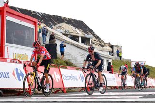 ESPINOSA DE LOS MONTEROS SPAIN AUGUST 16 LR Primoz Roglic of Slovenia and Team Jumbo Visma red leader jersey and Adam Yates of United Kingdom and Team INEOS Grenadiers crosses the finishing line in the 76th Tour of Spain 2021 Stage 3 a 2028km stage from Santo Domingo de Silos to Espinosa de los Monteros Picn Blanco 1485m lavuelta LaVuelta21 CapitalMundialdelCiclismo on August 16 2021 in Espinosa de los Monteros Spain Photo by Stuart FranklinGetty Images