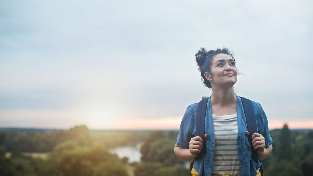 Calm, happy person goes for a walk