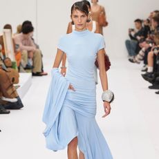 Model wears the baby blue color trend on the runway.