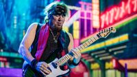Adrian Smith performing with Iron Maiden in 2024
