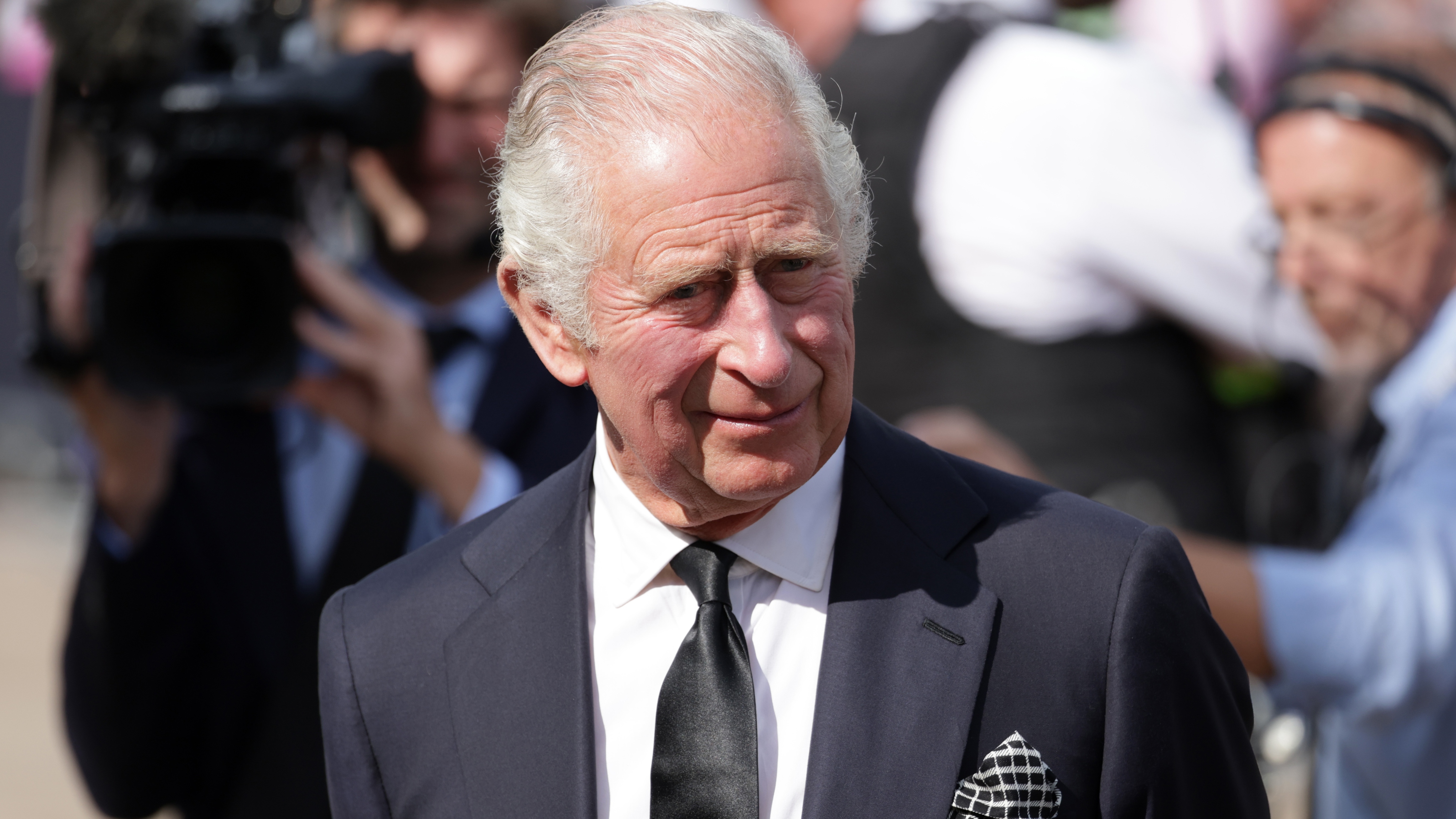 King Charles III views floral tributes to the late Queen Elizabeth II outside Buckingham Palace on September 09, 2022