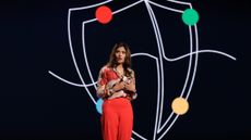 Vasu Jakkal, corporate vice president, Microsoft Security, stood on the RSAC Conference 2025 keynote stage with a stylized Google Threat Intelligence logo behind her.