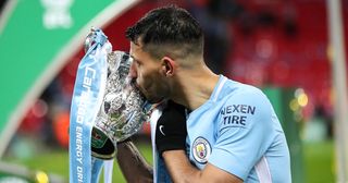 Sergio Aguero of Manchester City kisses and celebrates with the Carabao Cup trophy during the Carabao Cup Final match between Arsenal and Manchester City at Wembley Stadium on February 25, 2018 in London, England.
