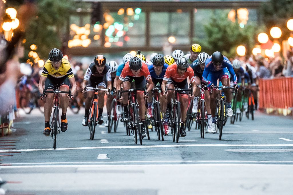 On the bell lap Brad Huff is tucked behind two of his Rally Cycling teammates as Tom Zirbel pulls to the side.