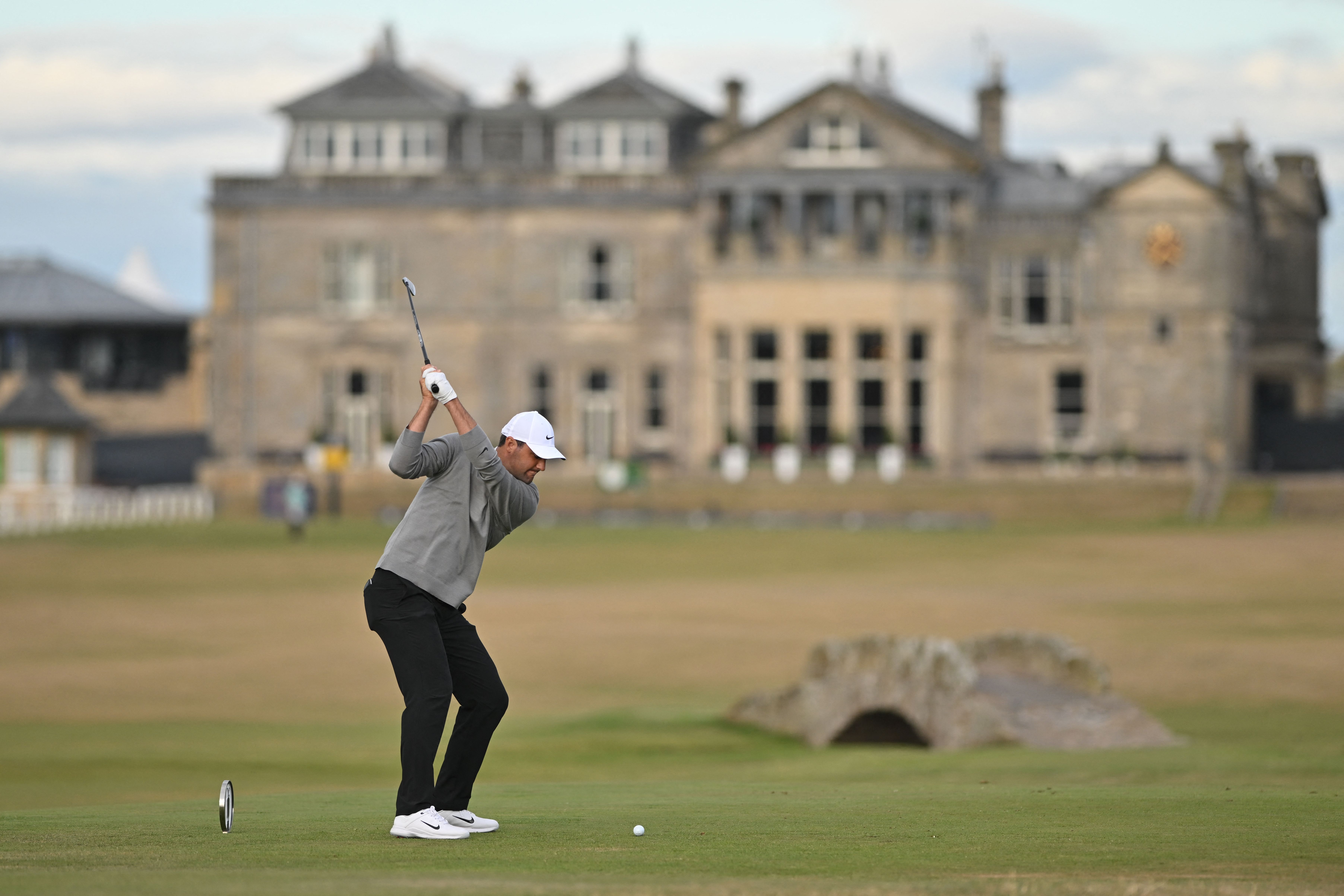 Scottie Scheffler teeing off on the final hole of the Old Course during round one of the 2022 Open Championship