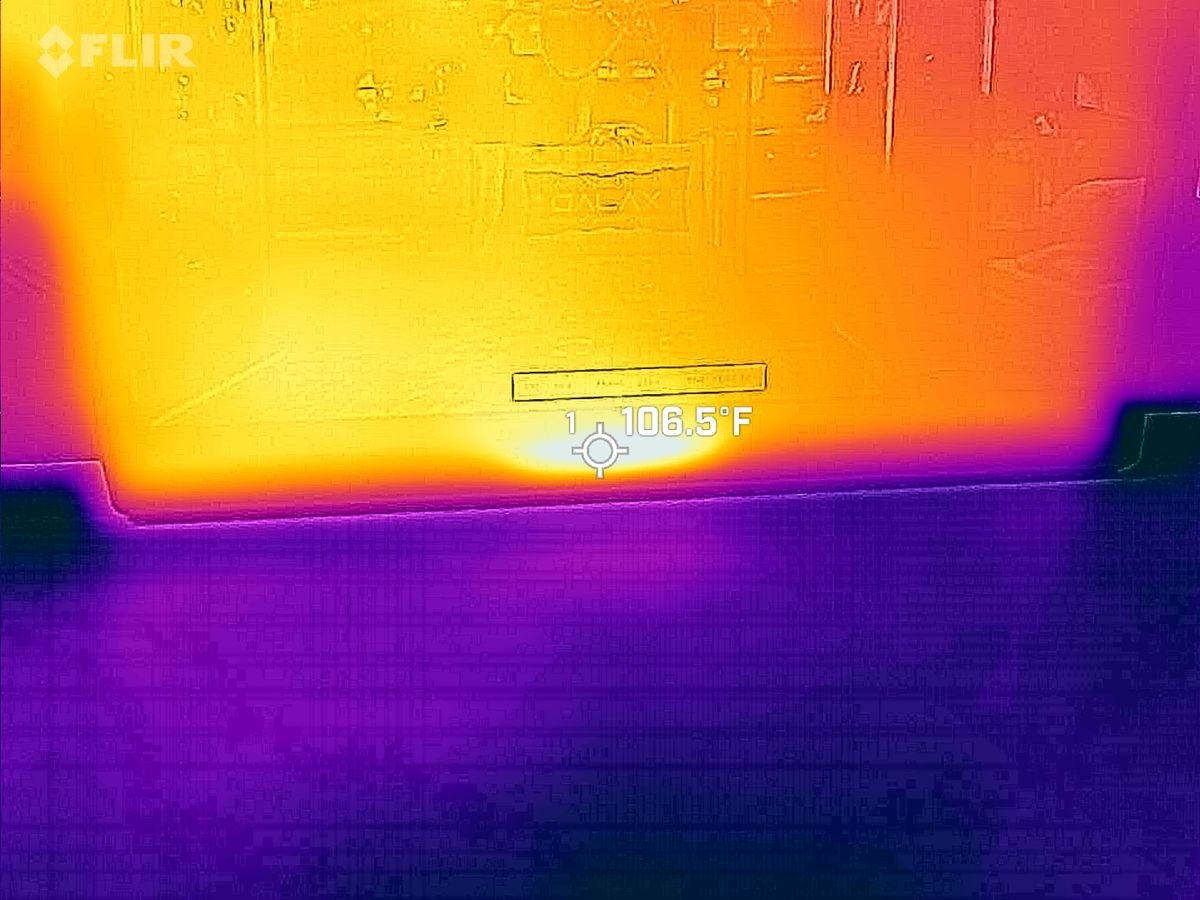 Close-up FLIR thermal view of the bottom edge of the device, capturing a concentrated heat signature near the lower bezel reading 106.5&deg;F.