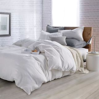 A DKNY Pure Comfy Comforter & Sham Set in a modern bedroom
