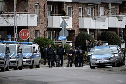 In Alsdorf, Germany, police search for a suspect in the November Paris attacks.