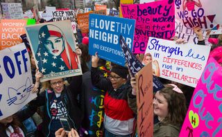 Women's march protestors with placards