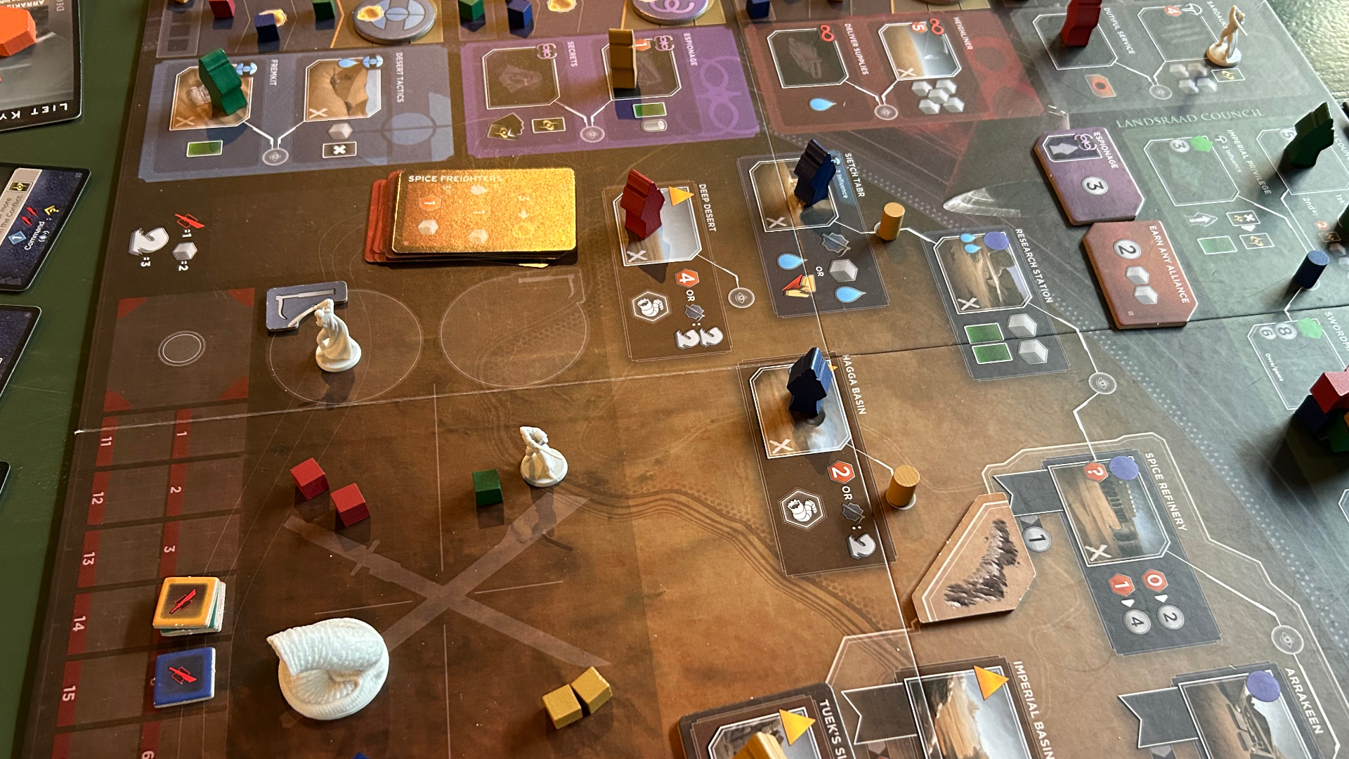 Miniatures and cards laid out across the Dune: Imperium - Underworlds board