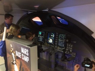 A simulator of NASA's Orion spacecraft lets users attempt to dock the craft with a space station orbiting Mars.