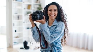 Joyful Professional Photographer Lady Holding Camera