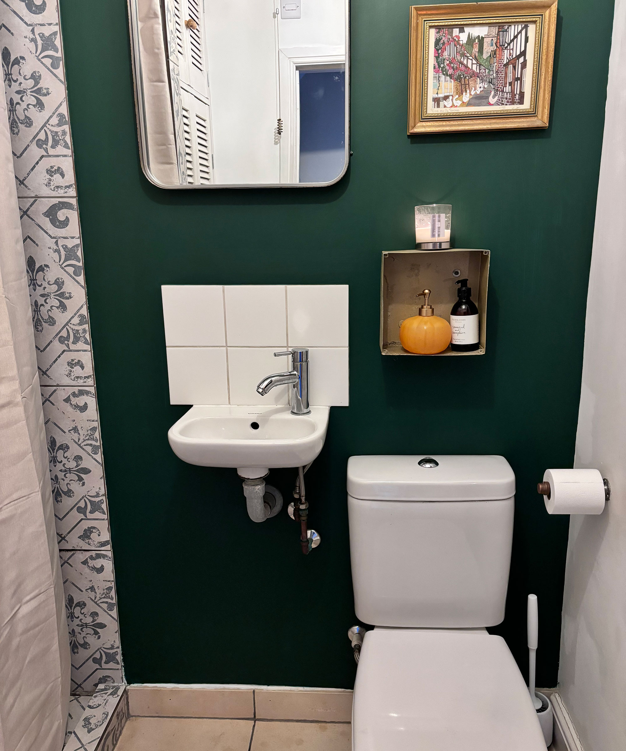 small green bathroom with compact sink