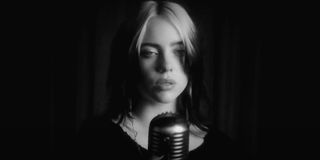 No Time To Die Billie Eilish singing at a vintage microphone