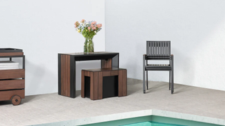A compact outdoor table with an accompanying chair and stool